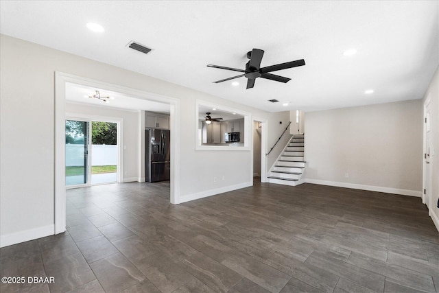 unfurnished living room with baseboards, stairs, visible vents, and recessed lighting