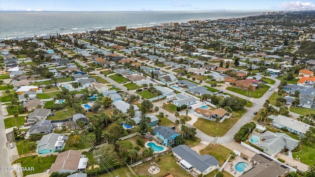 birds eye view of property featuring a water view and a residential view