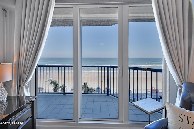 interior space featuring a view of the beach and a water view