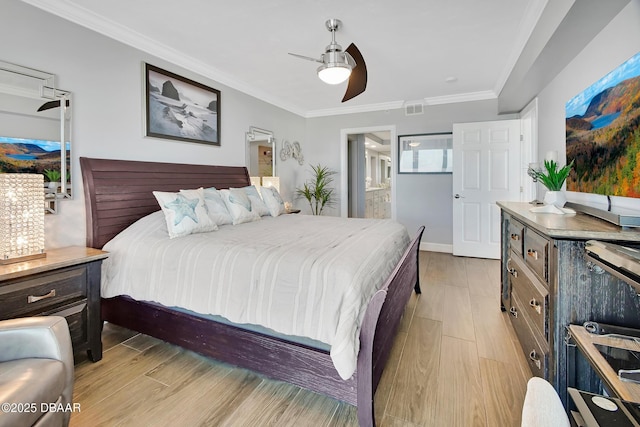 bedroom with visible vents, ceiling fan, crown molding, light wood-type flooring, and connected bathroom