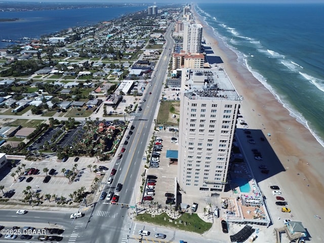 aerial view featuring a view of the beach, a view of city, and a water view