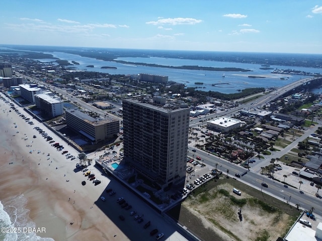 birds eye view of property with a city view and a water view