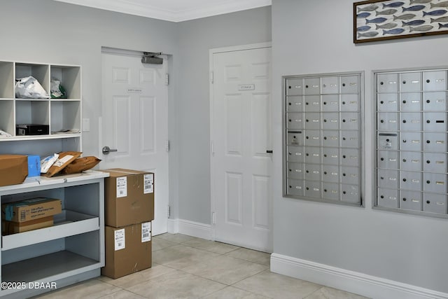 interior space with mail area, baseboards, light tile patterned flooring, and crown molding