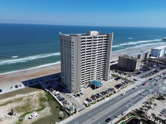 aerial view featuring a water view and a beach view