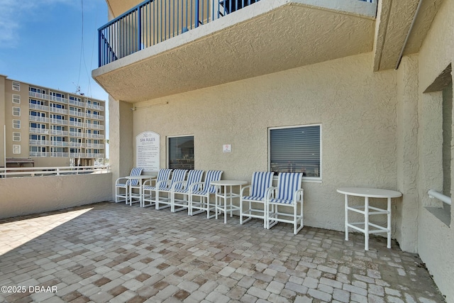 view of patio with a balcony