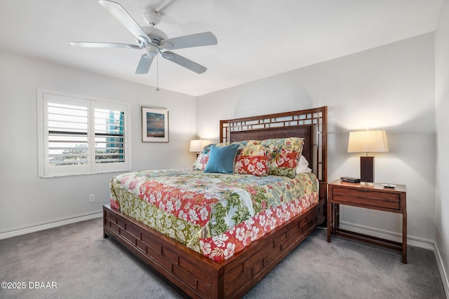 carpeted bedroom featuring ceiling fan and baseboards