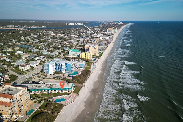 birds eye view of property featuring a water view, a city view, and a view of the beach