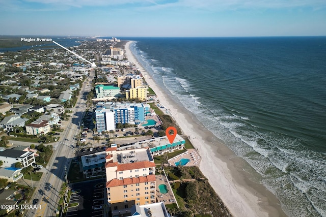 drone / aerial view with a water view and a view of the beach