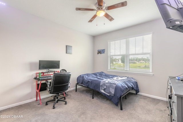 bedroom with light carpet and ceiling fan