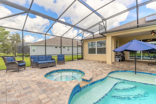 view of swimming pool featuring an in ground hot tub, a lanai, a patio, and an outdoor hangout area