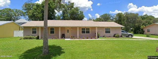 ranch-style house with a front lawn