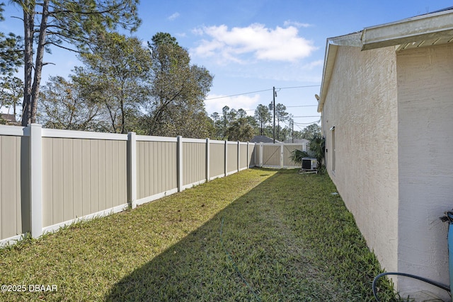 view of yard with central AC unit