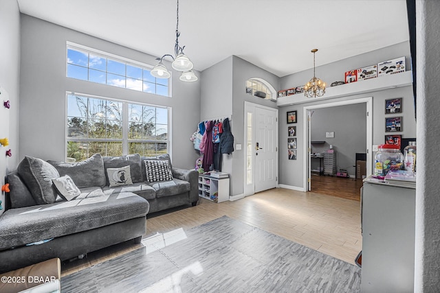 living room featuring hardwood / wood-style flooring and a chandelier