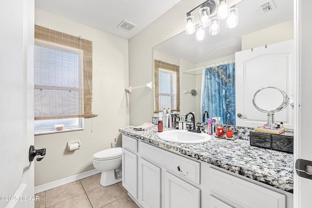 bathroom featuring tile patterned flooring, vanity, a shower with shower curtain, and toilet