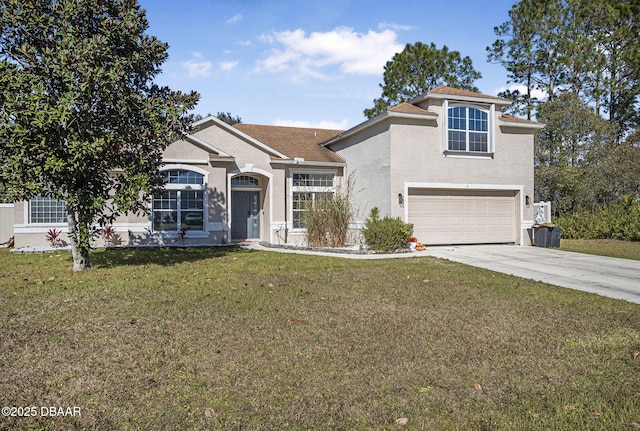 view of front facade with a garage and a front yard