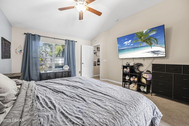 carpeted bedroom with vaulted ceiling and ceiling fan