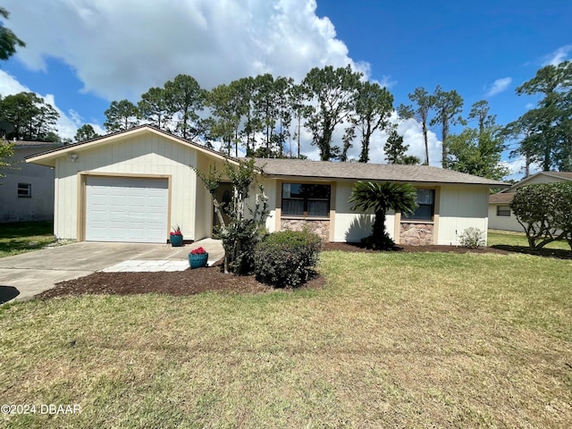 ranch-style home with a garage and a front lawn