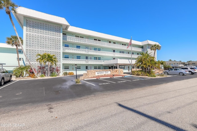 view of property featuring uncovered parking