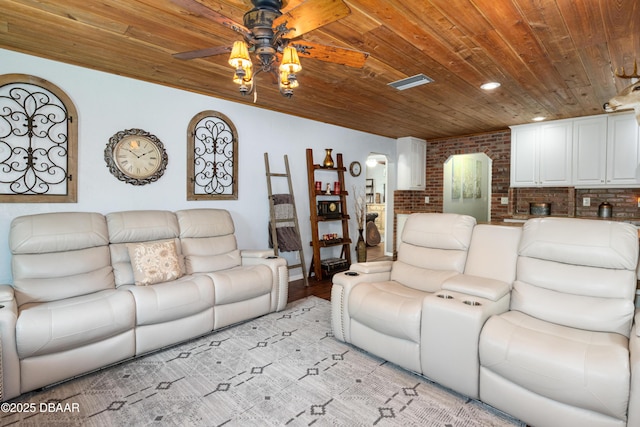 840 River Oak Dr W, Ormond Beach, FL 32174 - living area with wood ceiling, ceiling fan, brick wall, and light wood-type flooring