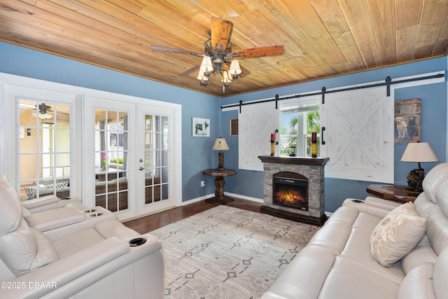 840 River Oak Dr W, Ormond Beach, FL 32174 - living area featuring wood ceiling, a ceiling fan, a barn door, french doors, and wood finished floors