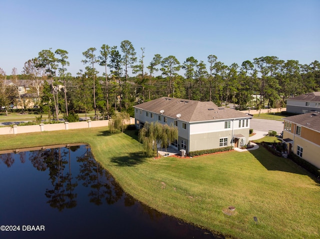 drone / aerial view with a water view