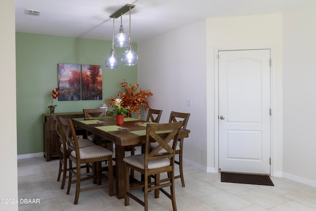 dining space featuring light tile patterned floors