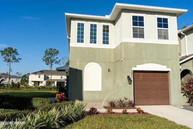 view of front of property with a garage