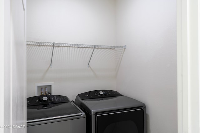 laundry room featuring washing machine and dryer