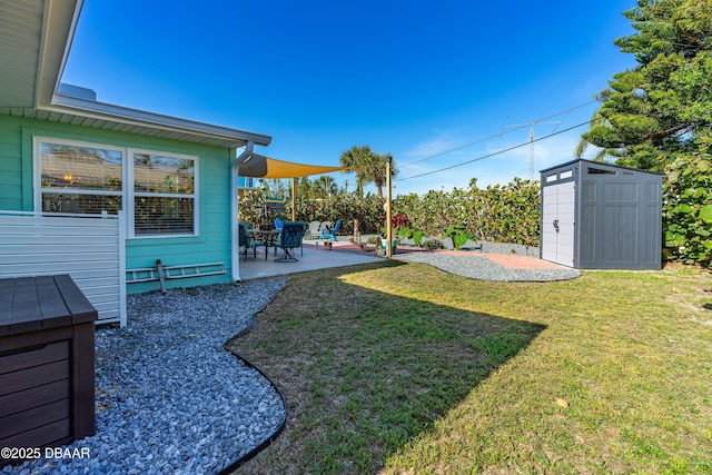 view of yard featuring a patio and a storage unit