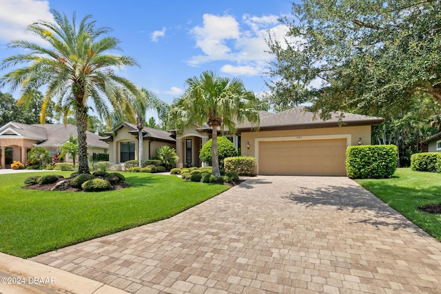 view of front facade featuring a garage and a front lawn