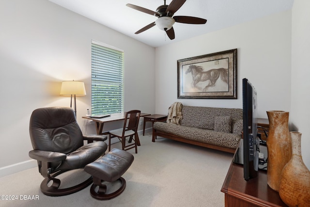 sitting room with carpet flooring and ceiling fan