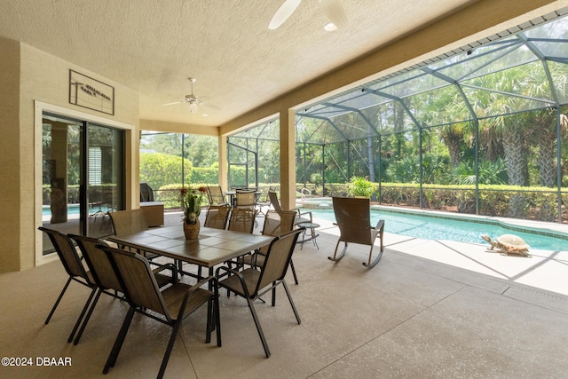 exterior space featuring ceiling fan and a pool