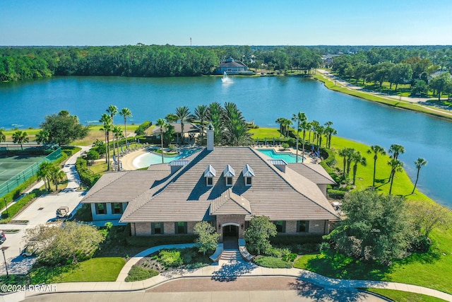 birds eye view of property with a water view