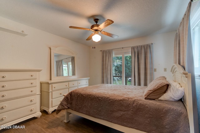 bedroom featuring a textured ceiling and ceiling fan