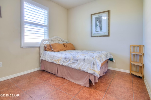 tiled bedroom featuring multiple windows