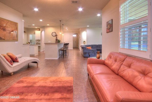 living room with light tile patterned flooring