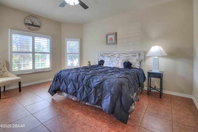 tiled bedroom featuring ceiling fan