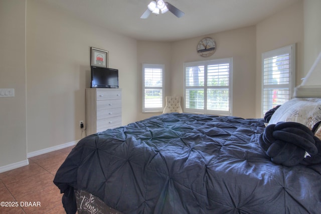 bedroom with tile patterned flooring and ceiling fan