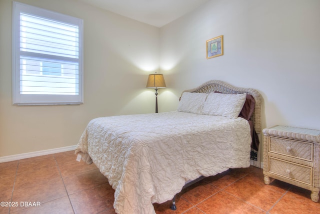 tiled bedroom with multiple windows