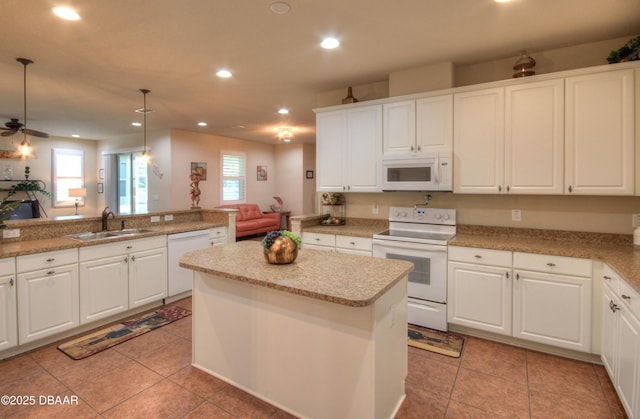 kitchen featuring sink, white cabinetry, white appliances, ceiling fan, and pendant lighting