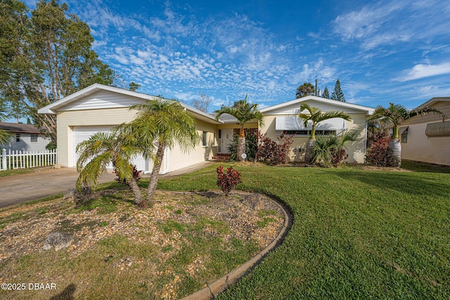 ranch-style home featuring a garage, concrete driveway, fence, and a front lawn