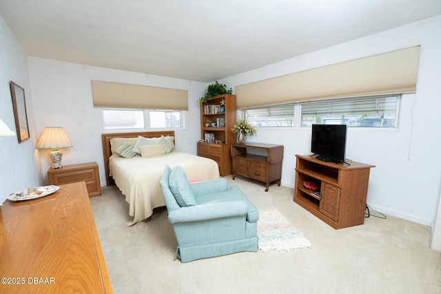 bedroom featuring carpet floors and baseboards