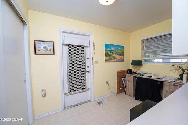 office area featuring visible vents and baseboards