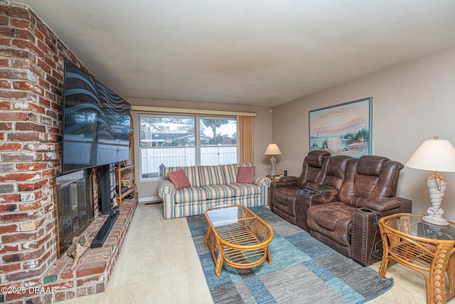 carpeted living area with a brick fireplace and baseboards