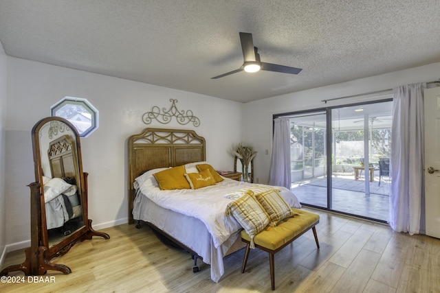 bedroom featuring a textured ceiling, access to outside, light hardwood / wood-style flooring, and ceiling fan