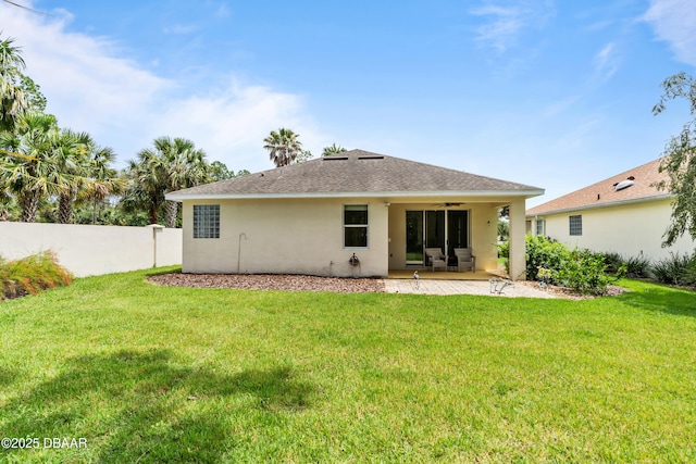 34 Raintree Cir, Palm Coast, FL 32164 - back of house with a ceiling fan, stucco siding, a patio area, and a shingled roof