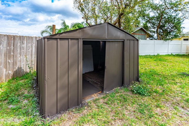 view of shed with a fenced backyard