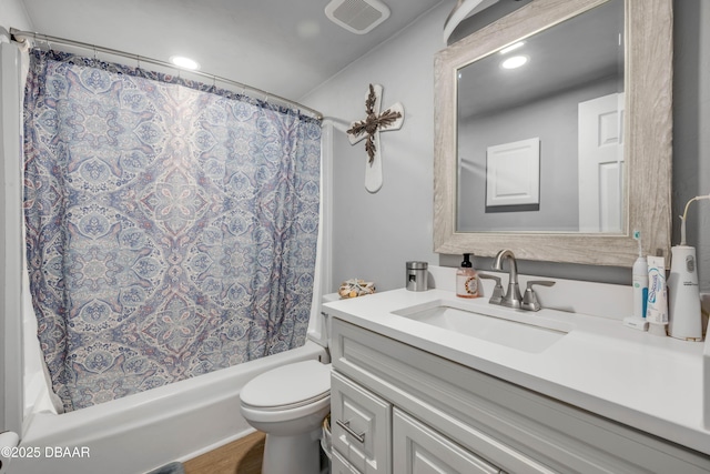 721 S Beach St Unit 215A, Daytona Beach, FL 32114 - bathroom featuring vanity, shower / bath combo with shower curtain, toilet, and recessed lighting