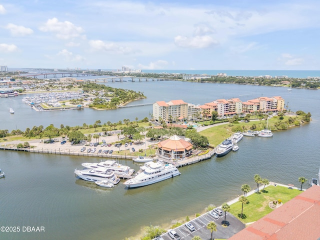 721 S Beach St Unit 215A, Daytona Beach, FL 32114 - drone / aerial view of a large body of water, apartment complex / building, a notable bridge, and numerous boat docks