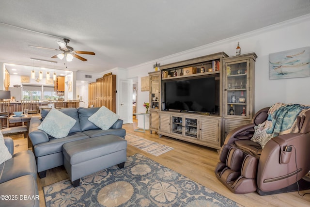 721 S Beach St Unit 215A, Daytona Beach, FL 32114 - living area featuring light wood-type flooring, a ceiling fan, and ornamental molding